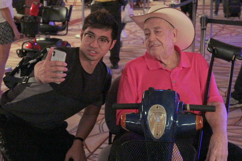 A fan grabs a selfie with Doyle Brunson A fan grabs a selfie with Doyle Brunson