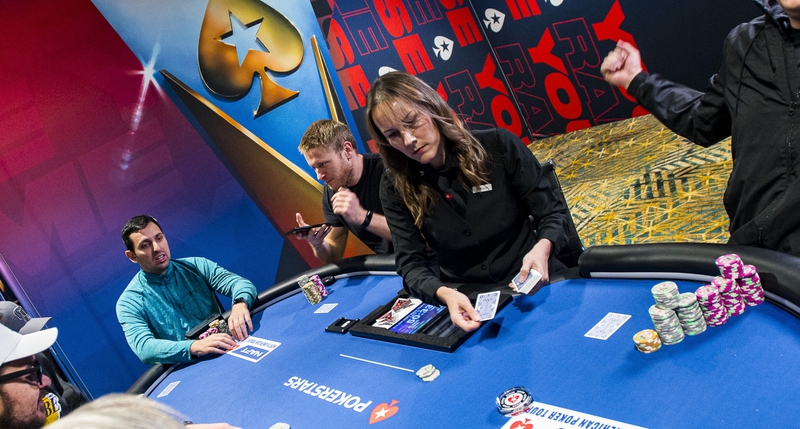 A dealer pitching cards at the 2023 North American Poker Tour A dealer pitching cards at the 2023 North American Poker Tour