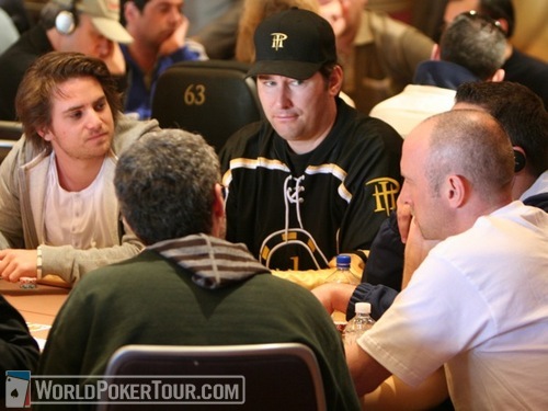 Phil Hellmuth studies Lee Markholt (right) on Day 1a of the WPT World Championship