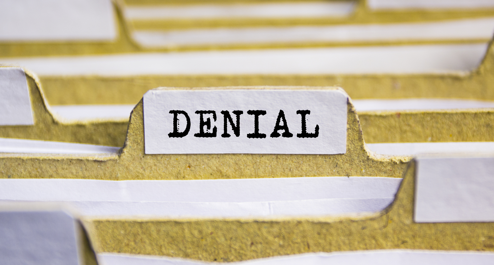 A picture of a file titled "DENIAL"