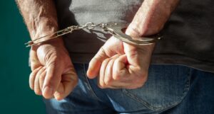 A picture of a man in handcuffs