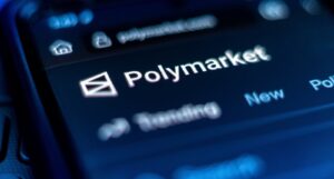 A picture of the Polymarket logo on a mobile phone.