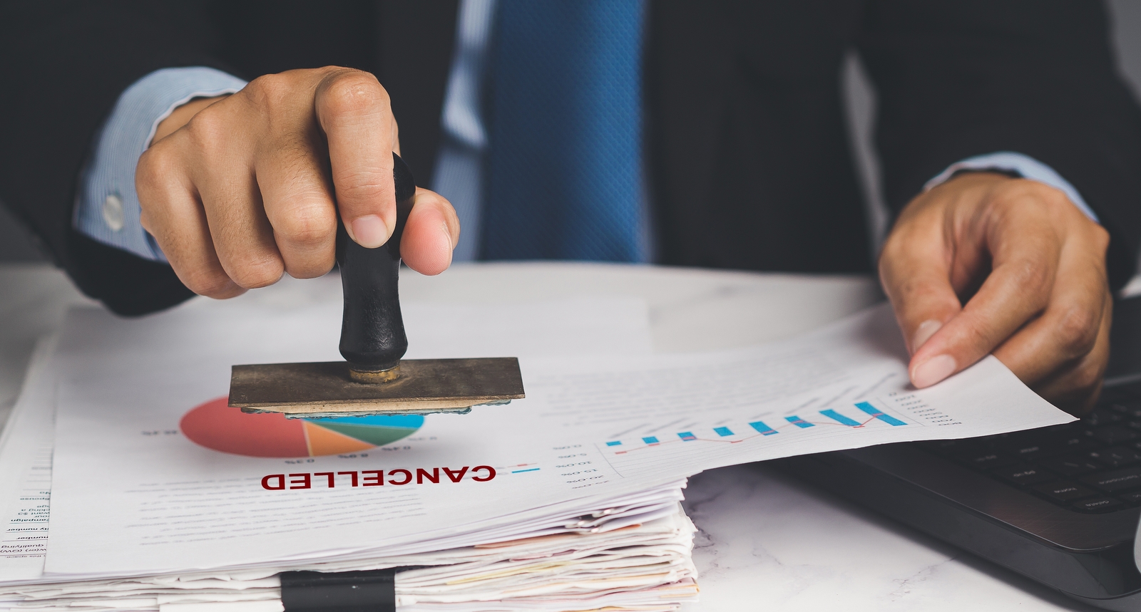 An image of a "canceled" stamp on a business report.