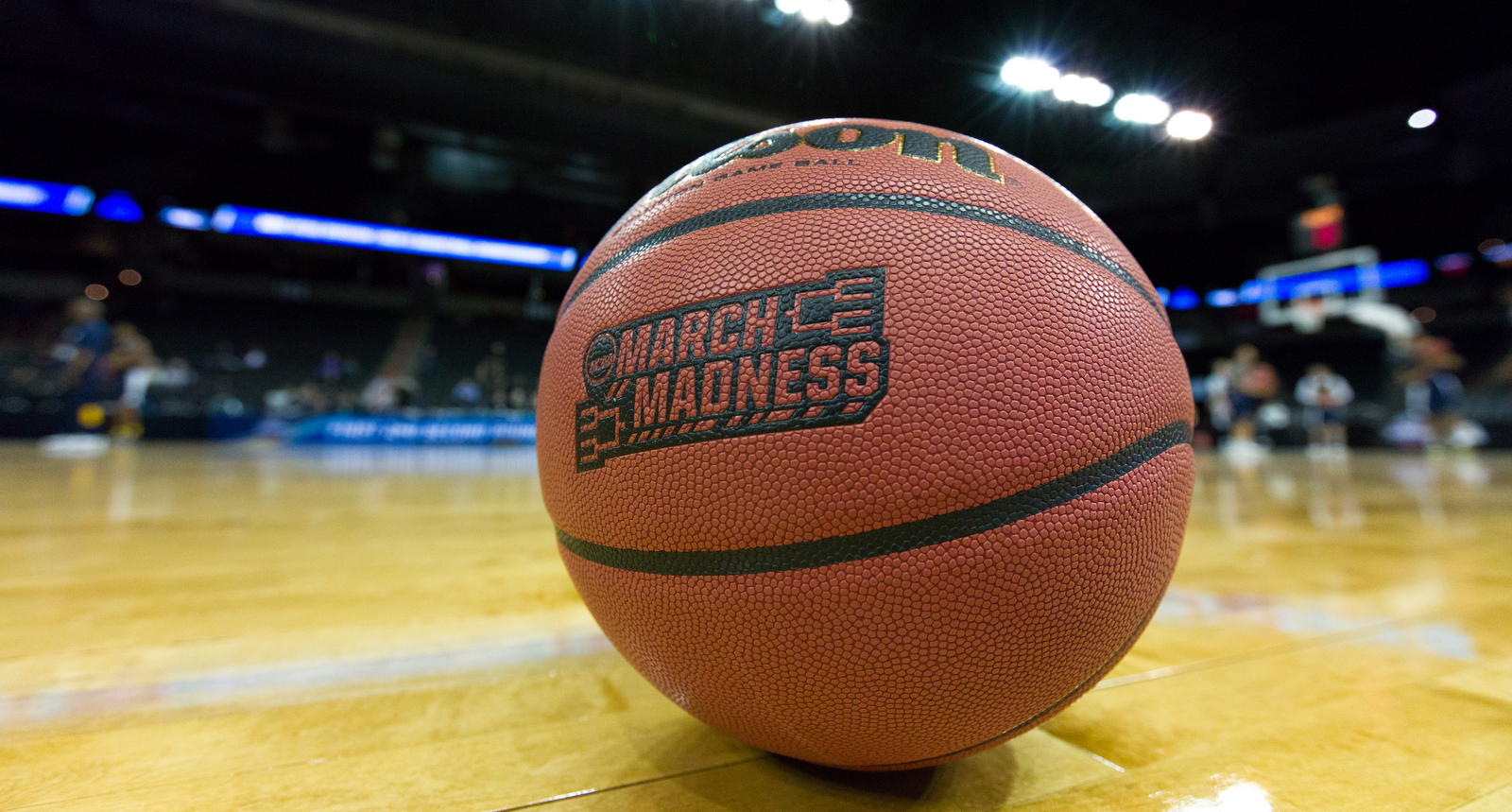 A picture of a basketball with the March Madness logo
