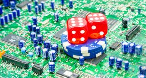 A picture of a computer board with casino chips and dice