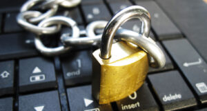 A picture of a lock and key over a keyboard