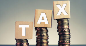 A picture of "TAX" spelled out with blocks