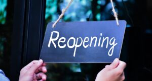 A picture of a reopening sign
