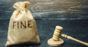 A picture of a money bag with the word fine on it