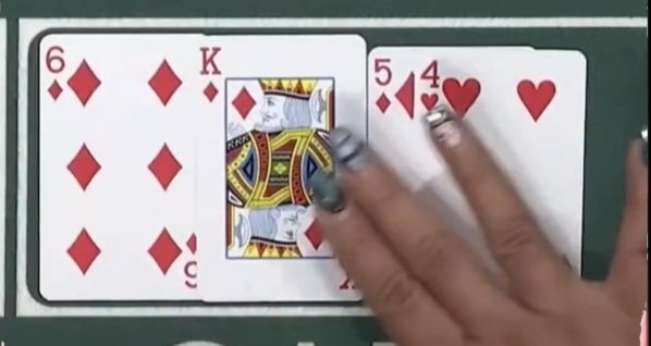 A screenshot of a dealer making a mistake with four cards on the flop