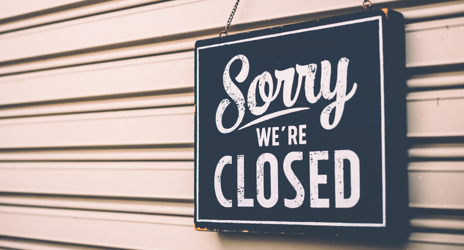 A picture of a "sorry we're closed" sign